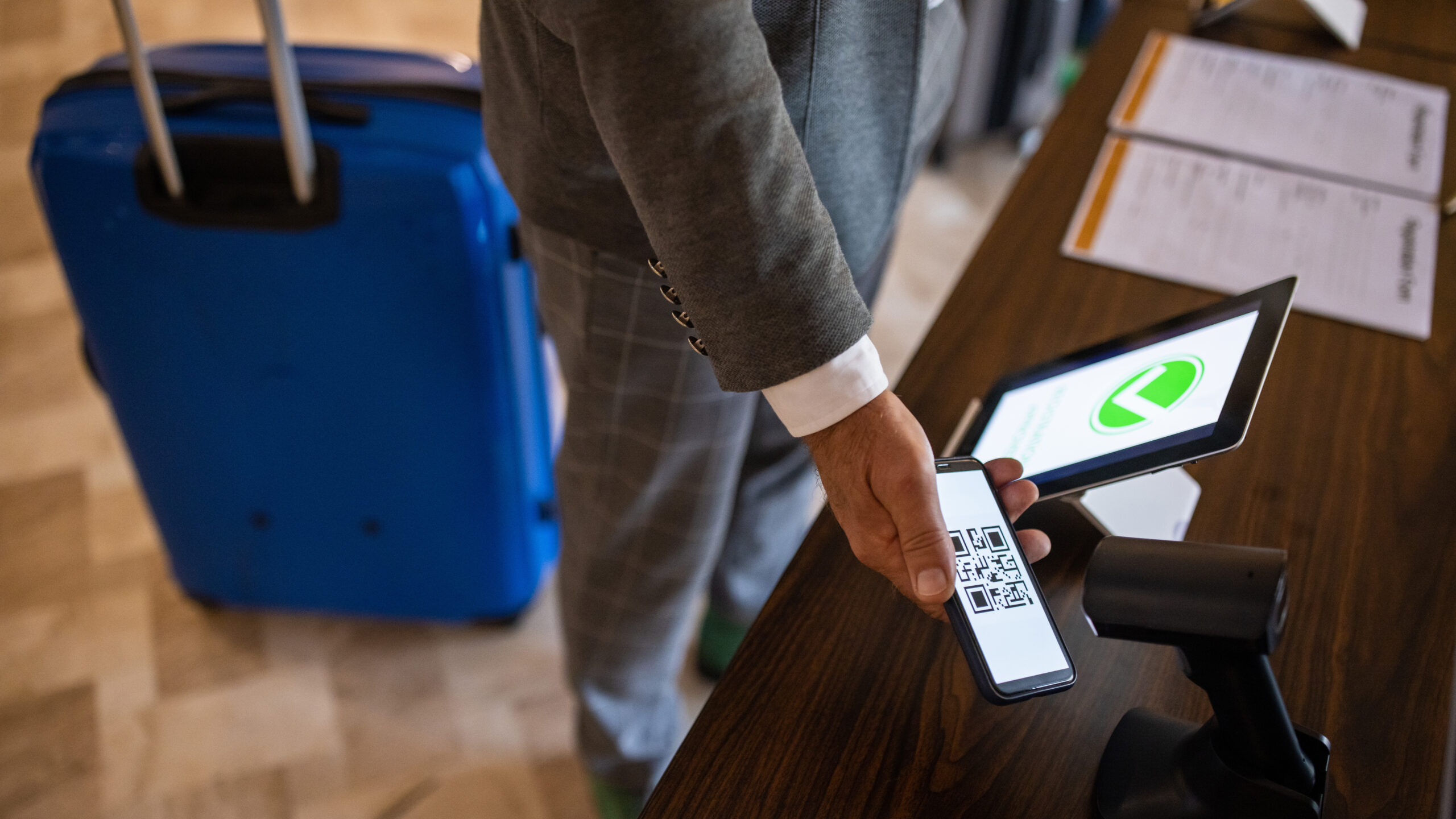 Unrecognizable businessman registering for a business conference using his smart phone